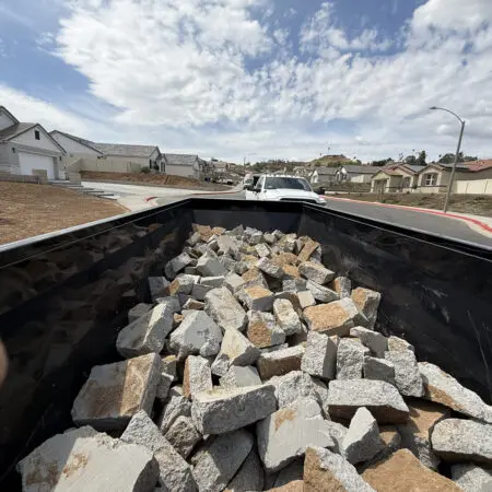 Dump trailer hauling concrete rubble