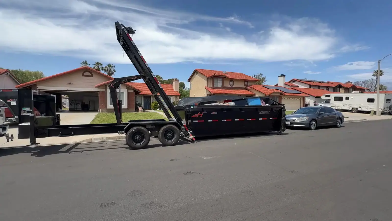 Residential dumpster delivery on street